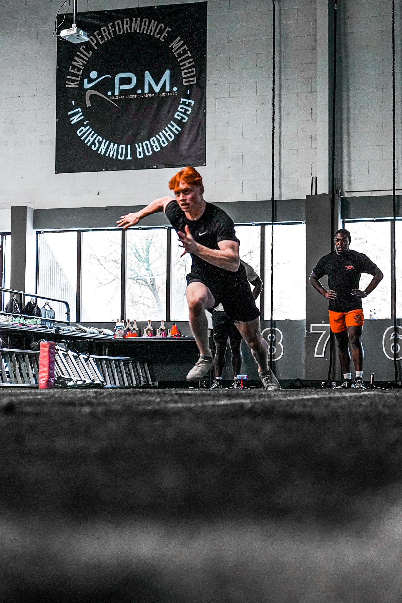A KPM athlete training on the facility floor